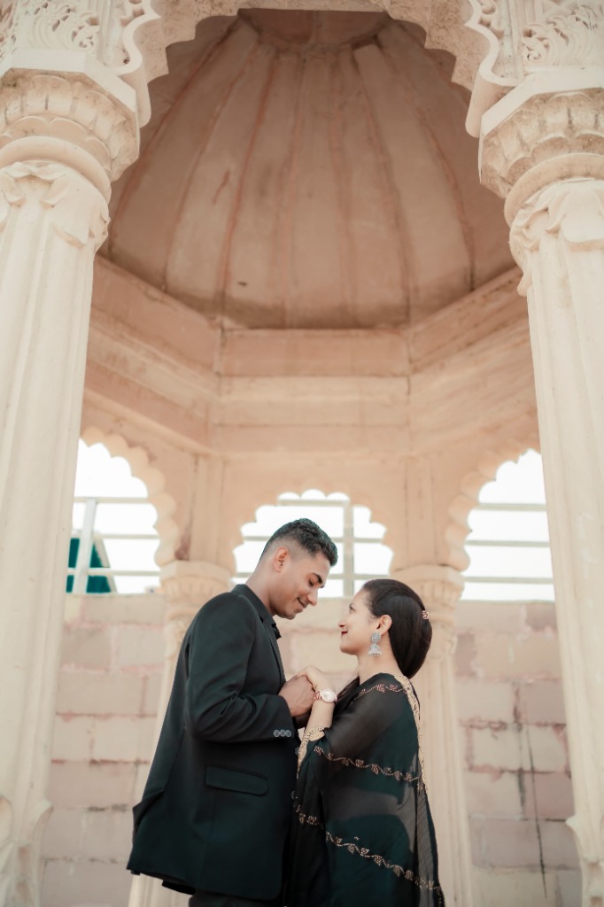 Faiz & Yasmin romantic pre-wedding portrait beneath carved stone gazebo pavilion