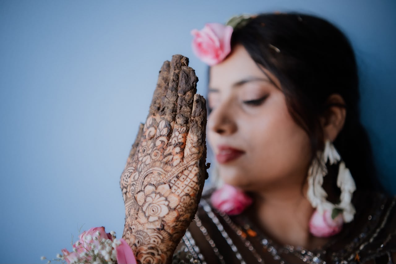 Macro close-up detail shot of delicate handcrafted bridal henna patterns